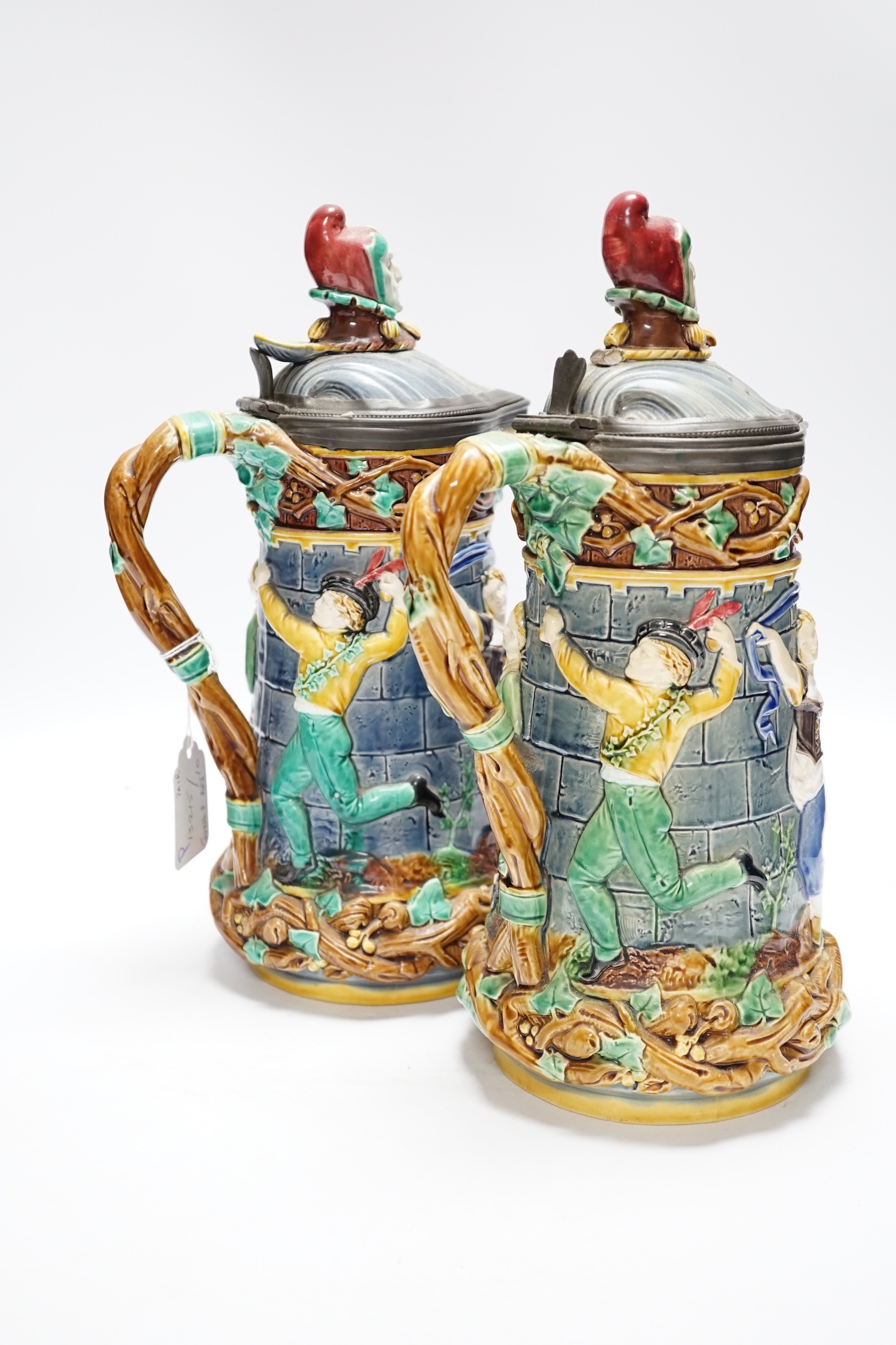 A pair of Victorian Minton majolica ‘Tower’ jugs, 33cm high